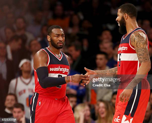 John Wall and Markieff Morris of the Washington Wizards celebrate the win over the New York Knicks at Madison Square Garden on January 19, 2017 in...