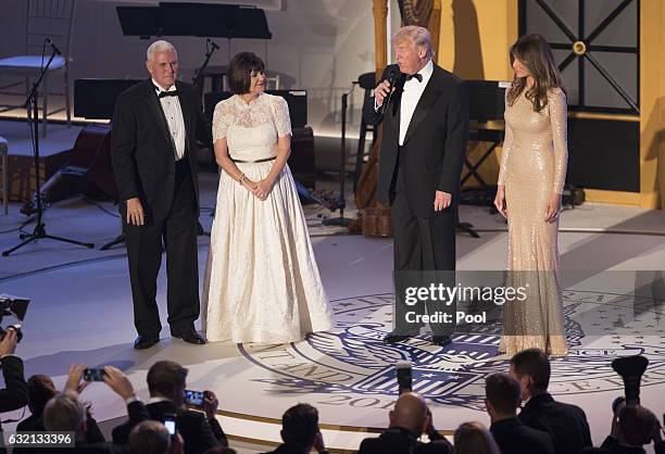 Vice President-elect Mike Pence , his wife Karen Pence and Melania Trump listen to President-elect Donald J. Trump speak at the Indiana Society Ball...