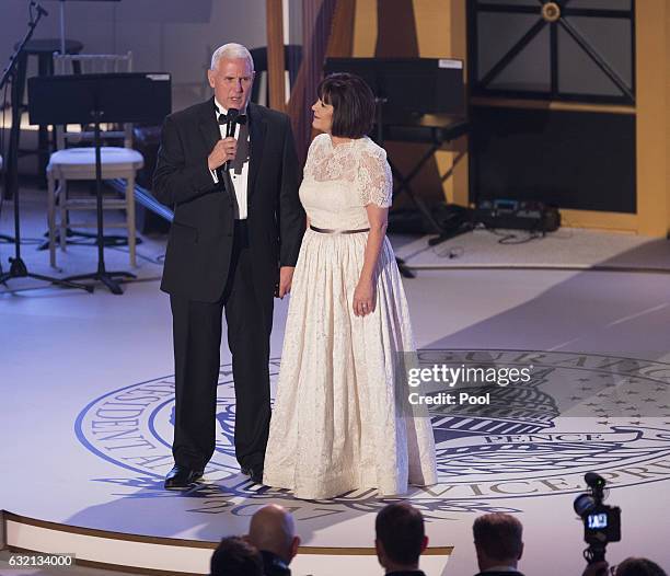 Vice President-elect Mike Pence speaks onstage as his wife Karen Pence looks on at the Indiana Society Ball to thank donors January 19, 2017 in...