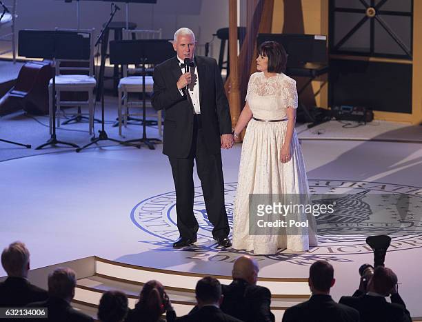Vice President-elect Mike Pence speaks onstage as his wife Karen Pence looks on at the Indiana Society Ball to thank donors January 19, 2017 in...