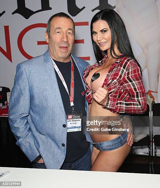 Adult film producer/director John Stagliano and adult film actress Jasmine Jae appear at the Evil Angel booth during the 2017 AVN Adult Entertainment...