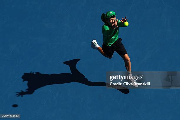 Ball kid catches a tennis ball during the third round match against Andy Murray of Great Britain and Sam Querrey of the United States on day five of...