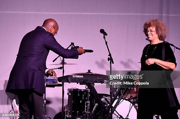Author Van Jones greets Political Activist Angela Davis onstage at the Busboys and Poets' Peace Ball: Voices of Hope and Resistance at National...
