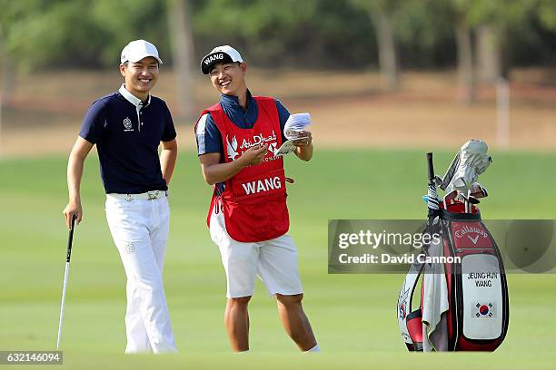 Jeunghun Wang of South Korea waits to play his second shot on the 17th hole during the second round of the 2017 Abu Dhabi HSBC Golf Championship at...