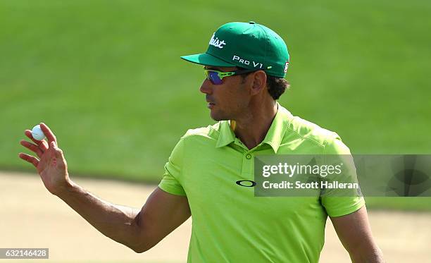 Rafa Cabrera-Bello of Spain acknowledges his birdie on the 8th green during the second round of the Abu Dhabi HSBC Championship at the Abu Dhabi Golf...
