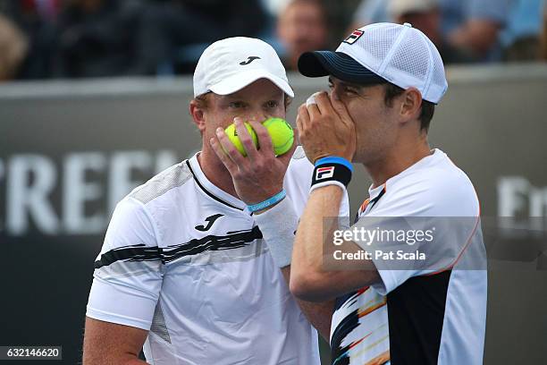 Matthew Barton and Matthew Ebden talk tactics in their second round doubles match against Pablo Carreno Busta and Guillermo Garcia-Lopez of Spain on...