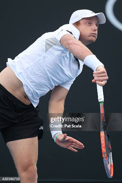 Matthew Barton of Australia plays a shot in his second round doubles match with Matthew Ebden of Australia against Pablo Carreno Busta and Guillermo...