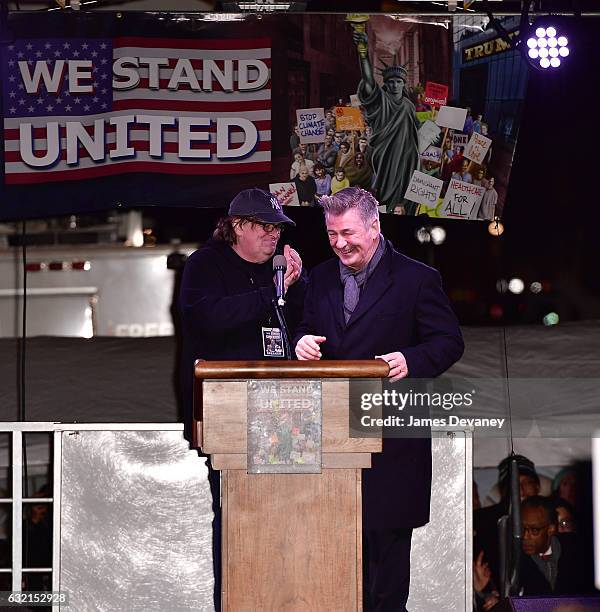 Michael Moore and Alec Baldwin speak at We Stand United NYC Rally outside Trump International Hotel & Tower on January 19, 2017 in New York City.