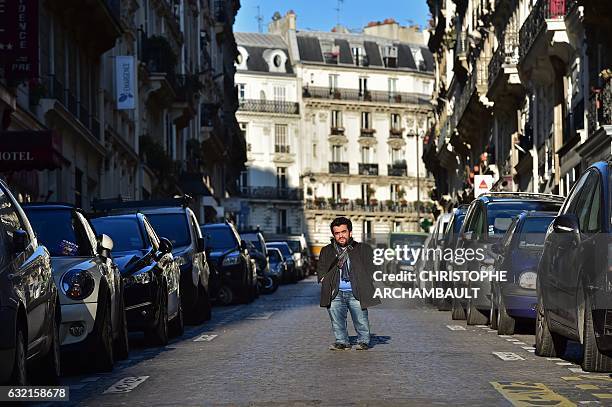 President of the French Association of Small People Othmane El Jamali poses for pictures in a street in Paris on January 6, 2017. Words like "dwarf"...