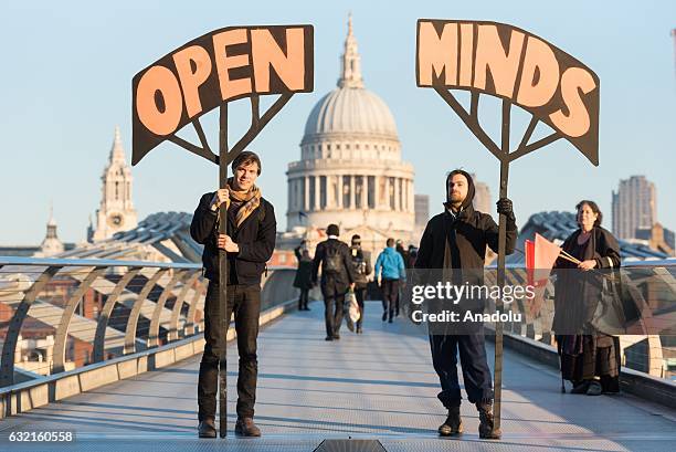 Anti Donald Trump demonstrators stage a peaceful protest on Millennium Bridge in London, England, U.K on January 20, 2017. The protest was ahead of...
