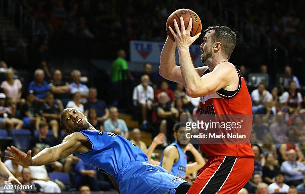 Akil Mitchell is fouled by Andrew Ogilvy of the Hawks during the round 16 NBL match between the Illawarra Hawks and the New Zealand Breakers at the...