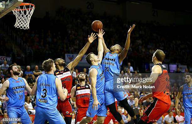 Kirk Penney and Akil Mitchell of the Breakers attempt to rebound during the round 16 NBL match between the Illawarra Hawks and the New Zealand...