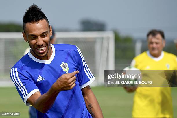 Gabon's forward Pierre-Emerick Aubameyang and Gabon's Spanish coach Jose Antonio Camacho attend a training session in Libreville on January 20, 2017...