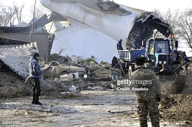 Kyrgyz rescue team remove the wreckage of a cargo plane that crashed into Dacha-SU villige near Bishkek, Kyrgyzstan on January 20, 2017. The Boeing...