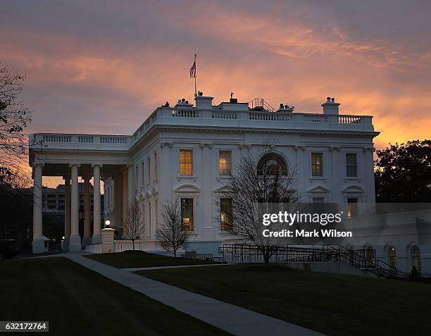 The early morning sun begins to rise behind the White House, on January 20, 2017 in Washington, DC. At 12 noon today President-elect Trump will be...