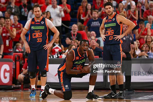 Mark Worthington, Nnanna Egwu and Stephen Weigh of the Taipans react after Bryce Cotton of the Wildcats was fouled in the dying seconds of the game...