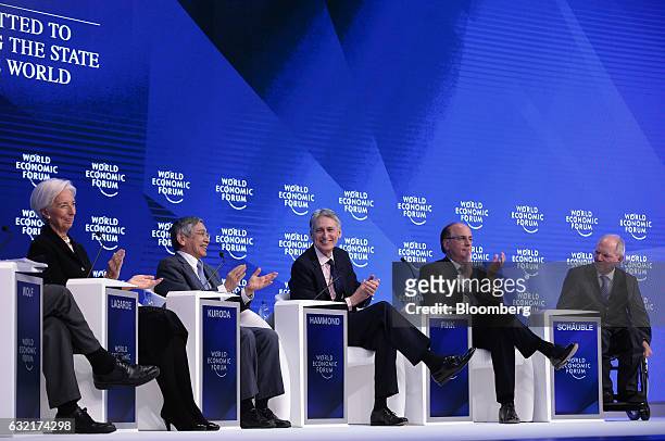 From left to right, Christine Lagarde, managing director of the International Monetary Fund , Haruhiko Kuroda, governor of the Bank of Japan , Philip...