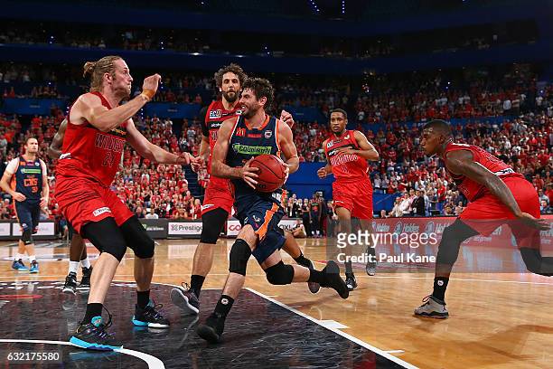 Jarrad Weeks of the Taipans drives to the basket against Jesse Wagstaff of the Wildcats during the round 16 NBL match between the Perth Wildcats and...