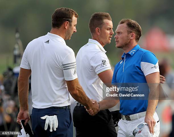 Dustin Johnson of the United States winer of the 2016 US Open shakes hands with Danny Willett of England winner of the 2016 Masters Tournament as...