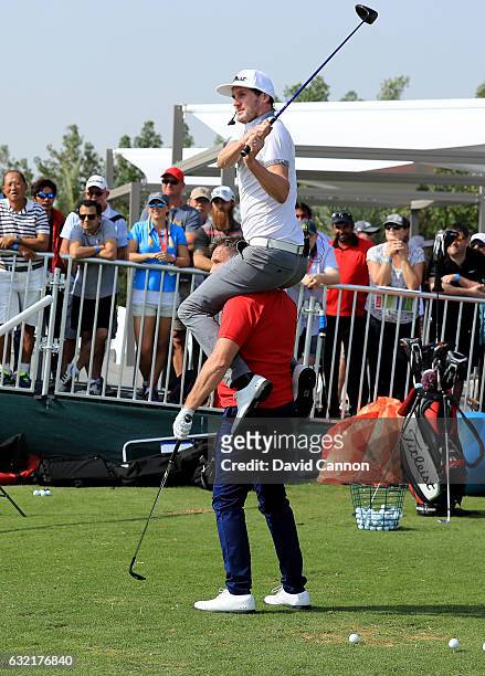 Geoff Swain of England and Kevin Carpenter of England the 'Golf Trick Shot Boys' performing on the range during the second round of the 2017 Abu...