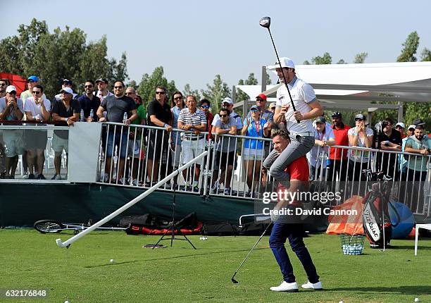 Geoff Swain of England and Kevin Carpenter of England the 'Golf Trick Shot Boys' performing on the range during the second round of the 2017 Abu...