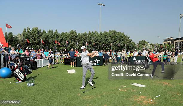 Geoff Swain of England and Kevin Carpenter of England the 'Golf Trick Shot Boys' performing on the range during the second round of the 2017 Abu...