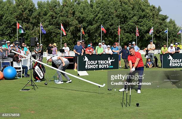 Geoff Swain of England and Kevin Carpenter of England the 'Golf Trick Shot Boys' performing on the range during the second round of the 2017 Abu...