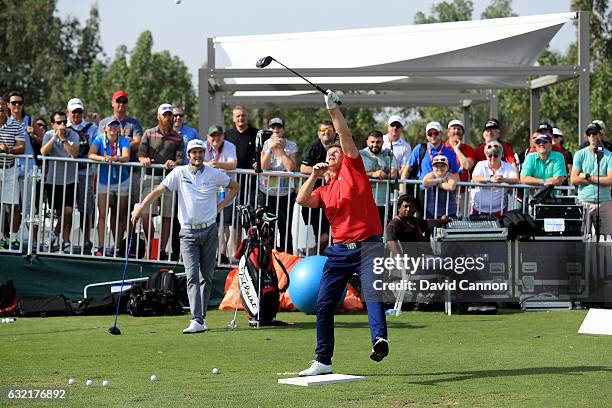 Geoff Swain of England and Kevin Carpenter of England the 'Golf Trick Shot Boys' performing on the range during the second round of the 2017 Abu...