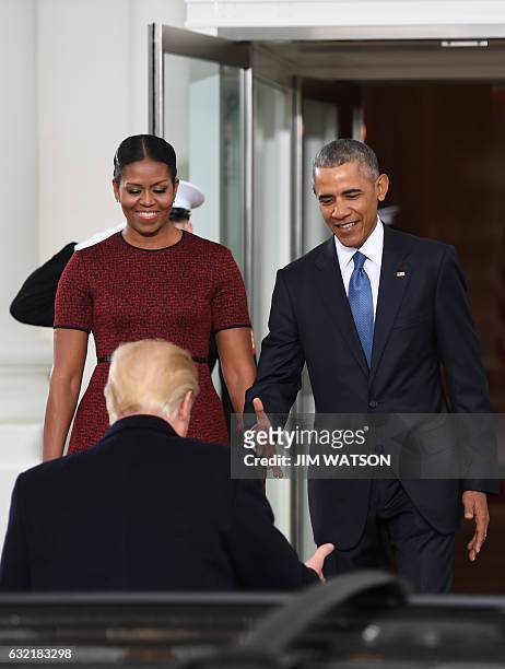 President-elect Donald Trumpis greeted by President Barack Obama and First Lady Michelle Obama as he arrives at the White House in Washington, DC...