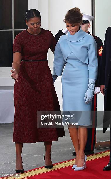 First lady Michelle Obama , greets Melania Trump after she and her husband president-elect Donald Trump arrived at the White House on January 20,...