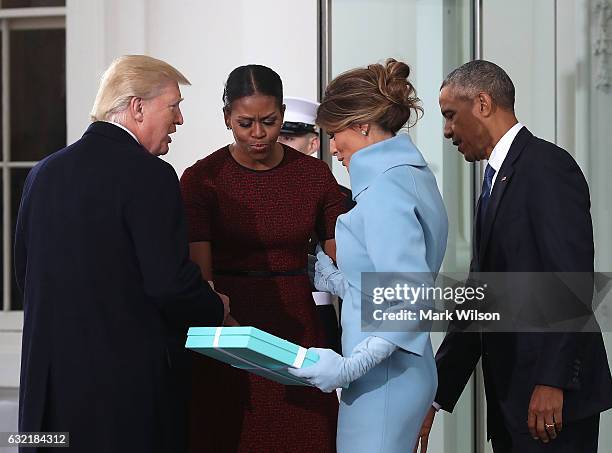 President-elect Donald Trump ,and his wife Melania Trump , are greeted by President Barack Obama and his wife first lady Michelle Obama, upon...