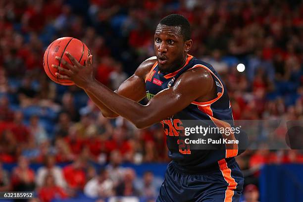 Nnanna Egwu of the Taipans looks to pss the ball during the round 16 NBL match between the Perth Wildcats and the Cairns Taipans at Perth Arena on...