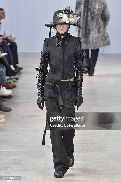 Model walks the runway at the Ann Demeulemeester Autumn Winter 2017 fashion show during Paris Menswear Fashion Week on January 20, 2017 in Paris,...