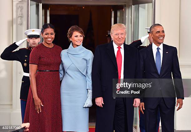 President Barack Obama and Michelle Obama pose with President-elect Donald Trump and wife Melania at the White House before the inauguration on...