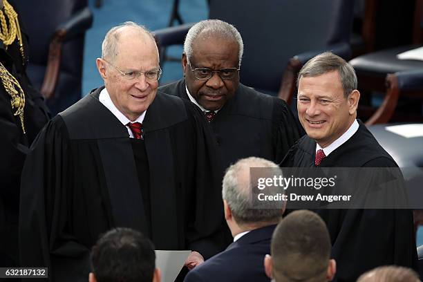 From left, Supreme Court Justices Anthony Kennedy, Clarence Thomas and John Roberts arrive on the West Front of the US Capitol, Washington, DC,...