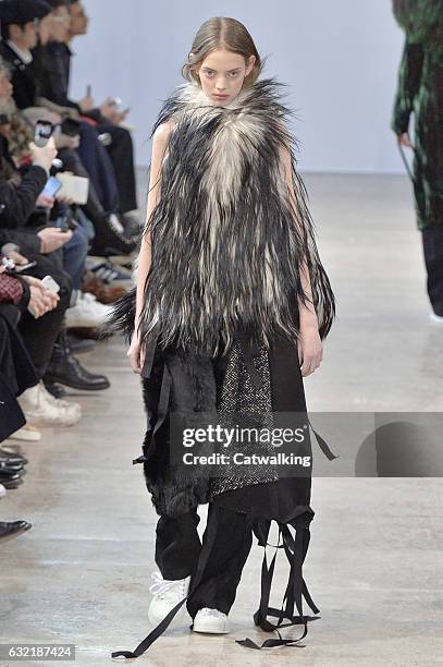 Model walks the runway at the Ann Demeulemeester Autumn Winter 2017 fashion show during Paris Menswear Fashion Week on January 20, 2017 in Paris,...