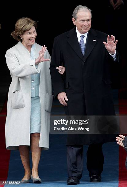Former President George W. Bush and Laura Bush wave as they arrive on the West Front of the U.S. Capitol on January 20, 2017 in Washington, DC. In...