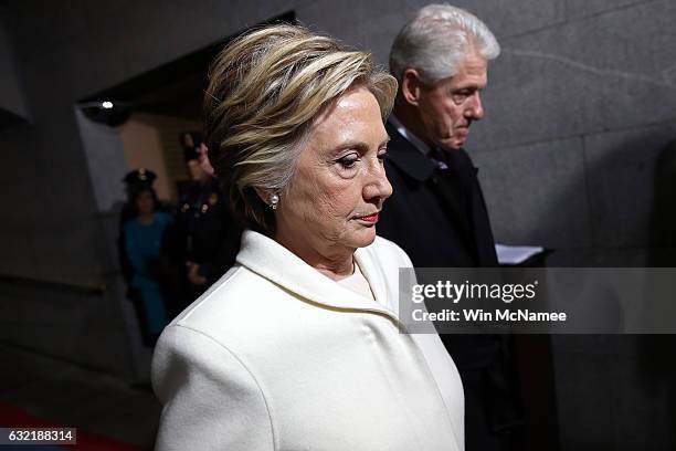 Former Democratic presidential nominee Hillary Clinton and former President Bill Clinton arrive on the West Front of the U.S. Capitol on January 20,...