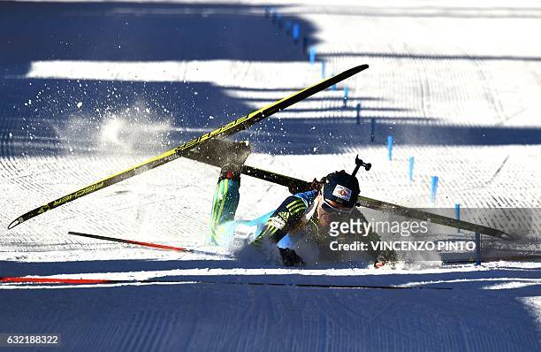 Sergey Semenov of Ukraine crashes as he crosses the finish line of the Biathlon World Cup Men's 20km individual race in Anterselva on January 20,...