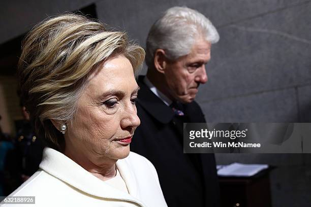 Former Democratic presidential nominee Hillary Clinton and former President Bill Clinton arrive on the West Front of the U.S. Capitol on January 20,...
