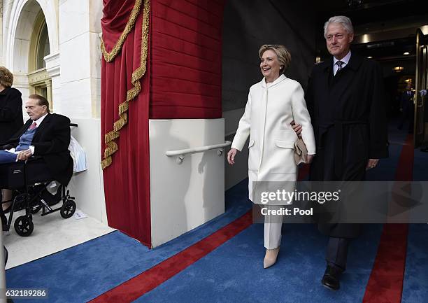 Former US President Bill Clinton and First Lady Hillary Clinton arrive for the Presidential Inauguration of Donald Trump at the US Capitol on January...