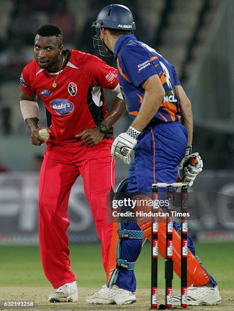 Cricket - Champions League T20 - CLT20 - Kieron Pollard of Trinidad shares a laugh with Ryan Bailey of Eagles during the Airtel Champions League...