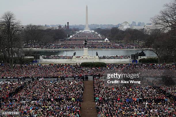Spectators fill the National Mall in front of the U.S. Capitol on January 20, 2017 in Washington, DC. In today's inauguration ceremony Donald J....