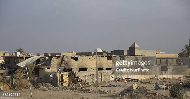 Picture taken on January 19, 2017 shows the rubble of a building in a street in the Iraqi city of Fallujah, that was recaptured from the Islamic...