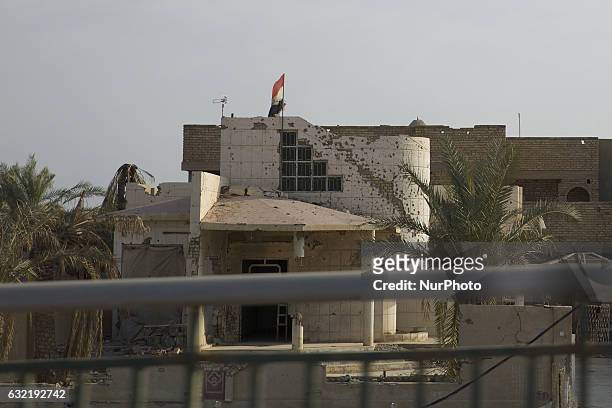 Picture taken on January 19, 2017 shows the rubble of a building in a street in the Iraqi city of Fallujah, that was recaptured from the Islamic...