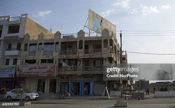 Picture taken on January 19, 2017 shows the rubble of a building in a street in the Iraqi city of Fallujah, that was recaptured from the Islamic...