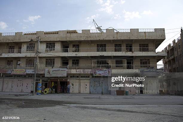 Picture taken on January 19, 2017 shows the rubble of a building in a street in the Iraqi city of Fallujah, that was recaptured from the Islamic...