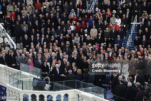 Vice President-elect Mike Pence takes the oath of office during the 58th presidential inauguration in Washington, D.C., U.S., on Friday, Jan. 20,...