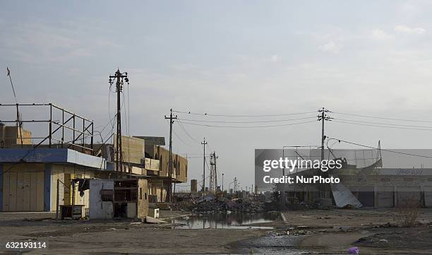 Picture taken on January 19, 2017 shows the rubble of a building in a street in the Iraqi city of Fallujah, that was recaptured from the Islamic...