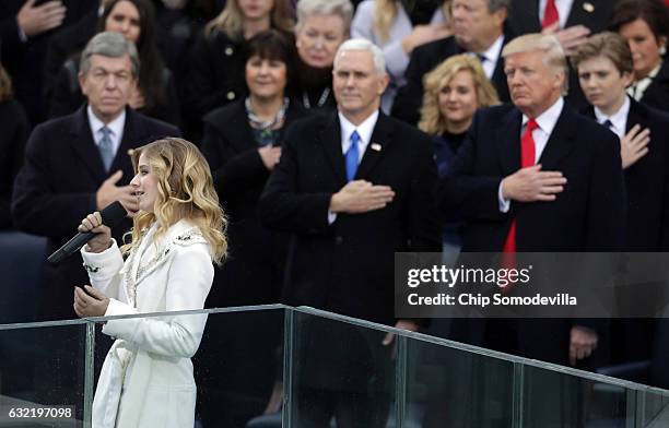 Jackie Evancho performs the National Anthem as Vice President Mike Pence and President Donald Trump watch on the West Front of the U.S. Capitol on...